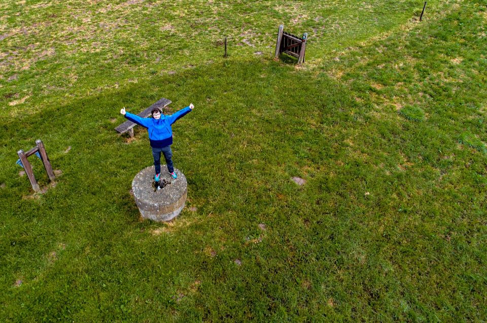 Happy tourist at the highest point of Denmark Møllehøj