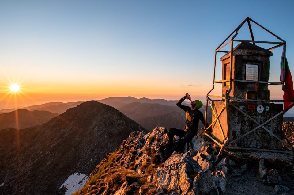 A hiker enjoying view from the mountain Musala udring sunrise