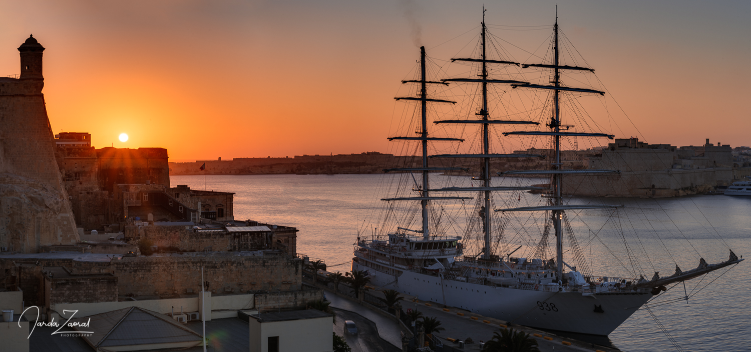Sunset at Valletta and a sailing boat