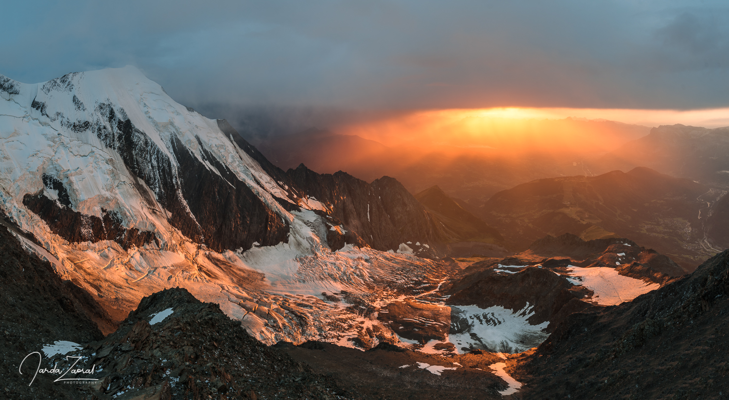 Sunset watching from the Gouter Hut over sharp mountains and sunset