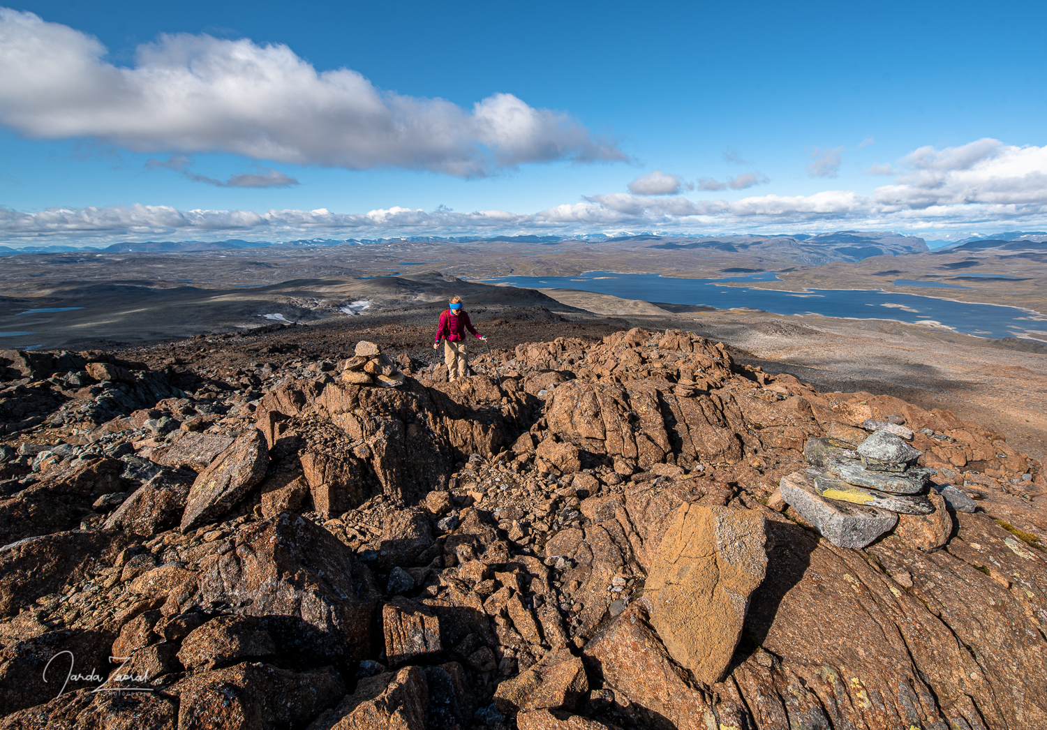 Hiker and a view over Norwegian lake Guolasjärvi