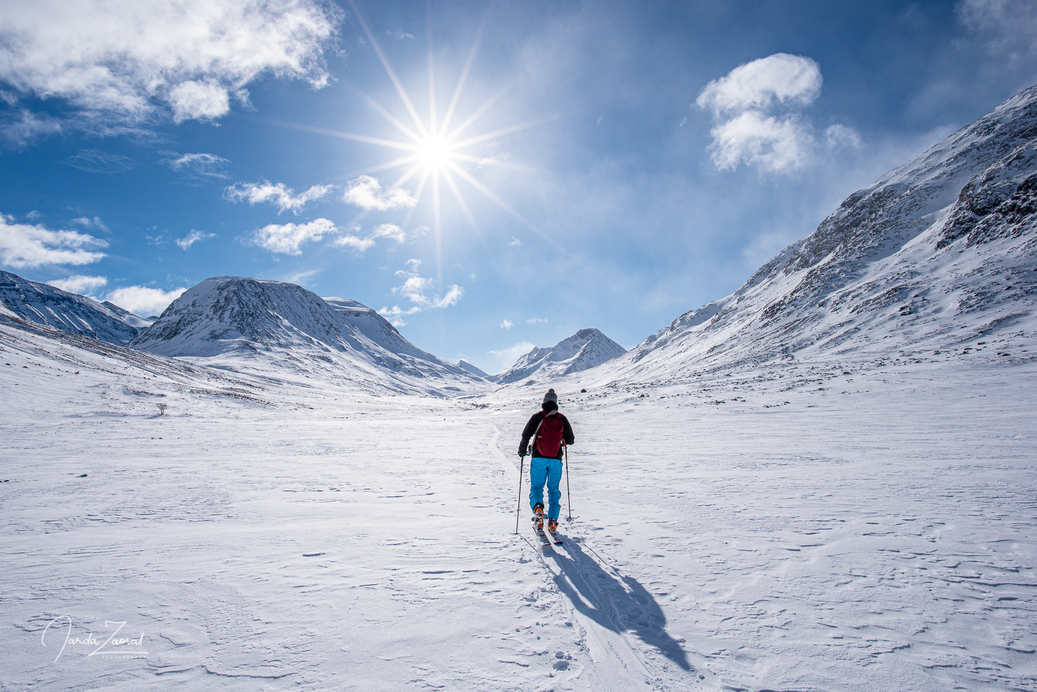 Skier in fascinating snowy mountains of Norway