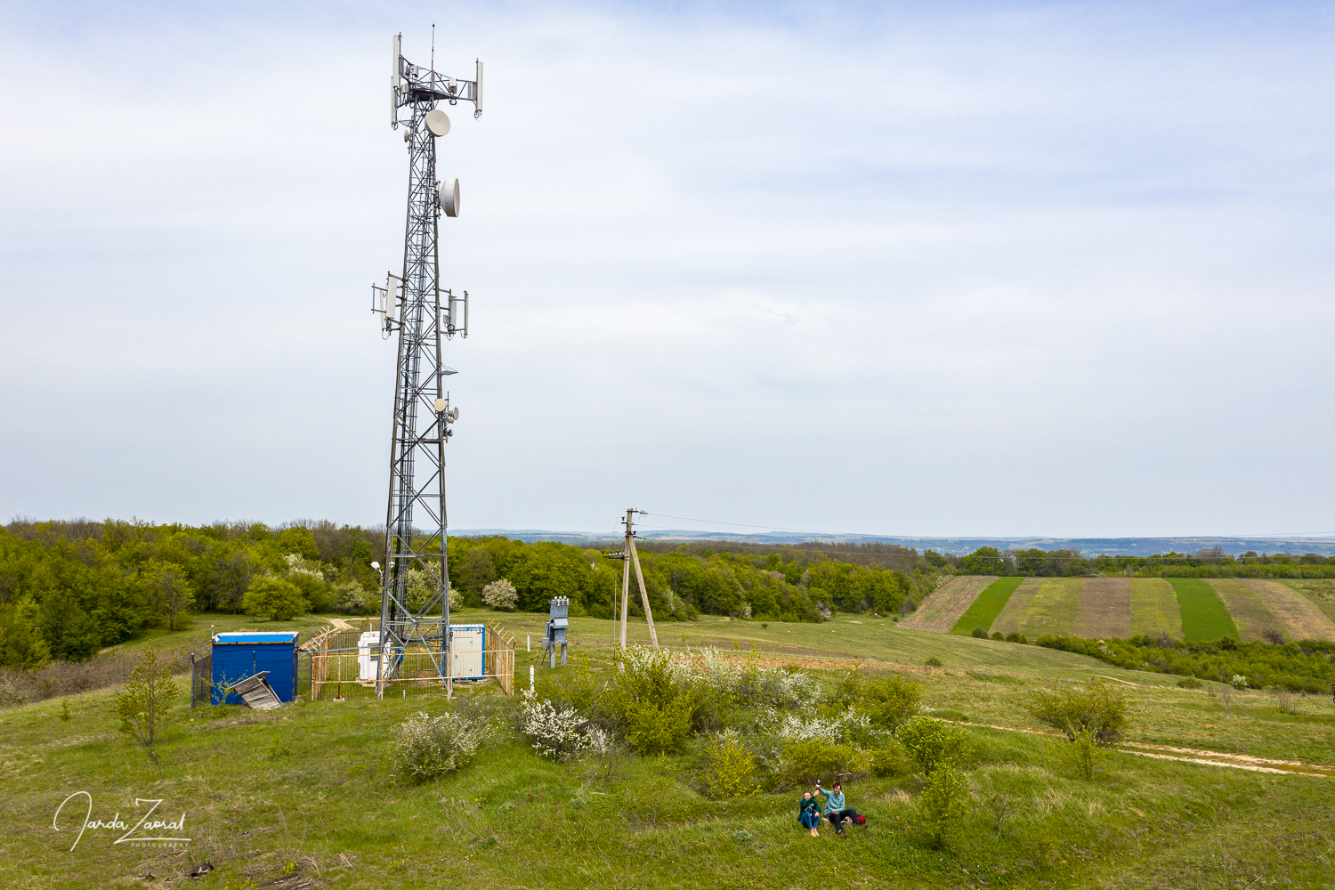 Two tourists on the highest point of Moldova