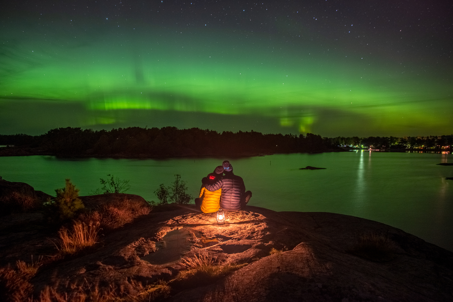 Couple under northern lights in Finland