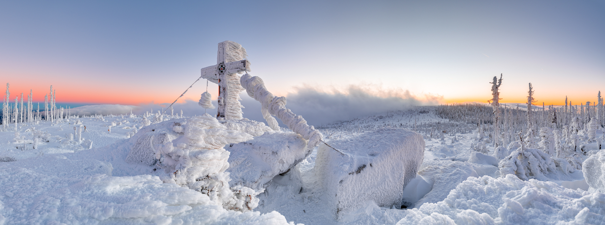 The highest point of Šumava - Plechý covered with snow during sunset