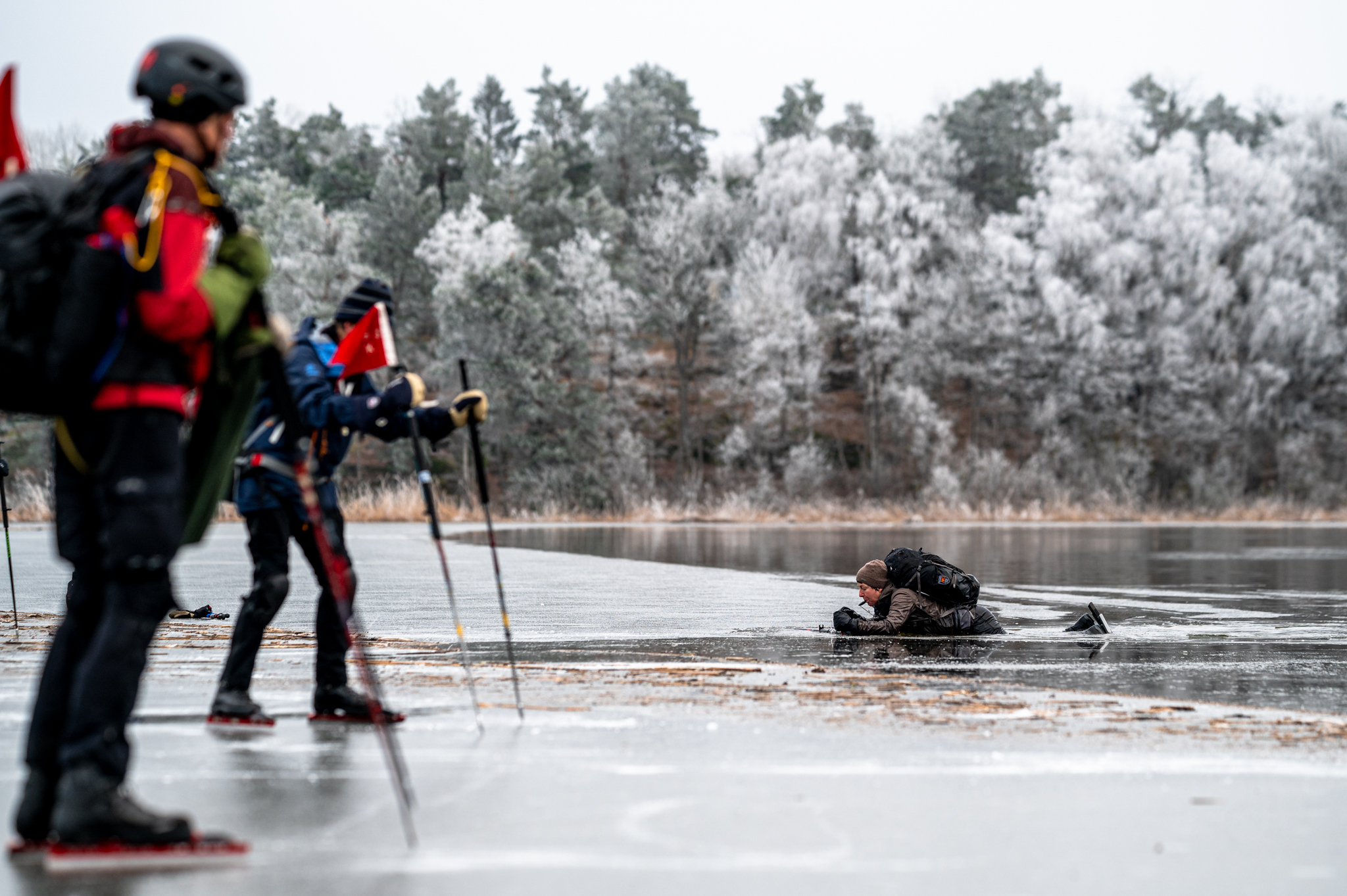 Rescue of a skater from a fall into of frozen lake