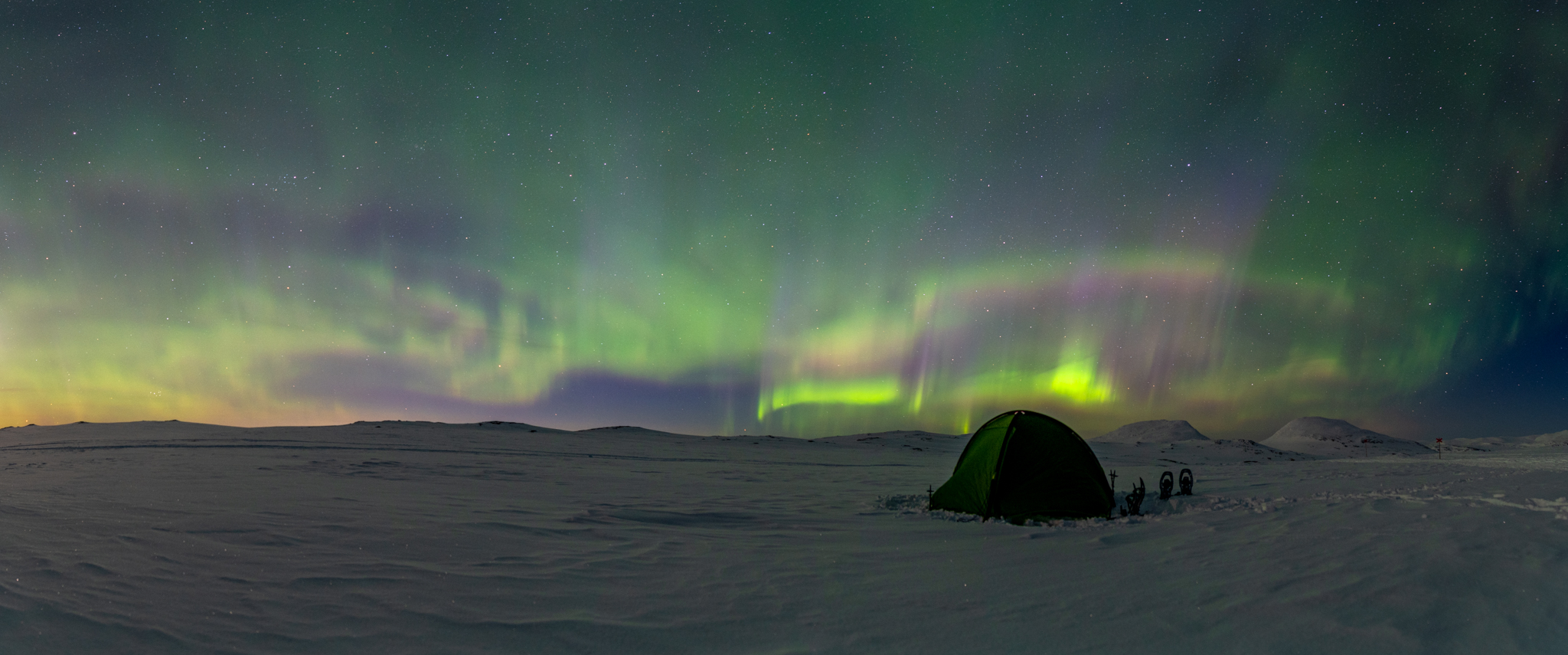 Watching northern lights from tent at Jämtlands Triangel