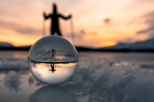 Magic ball with a skater on a frozen lake
