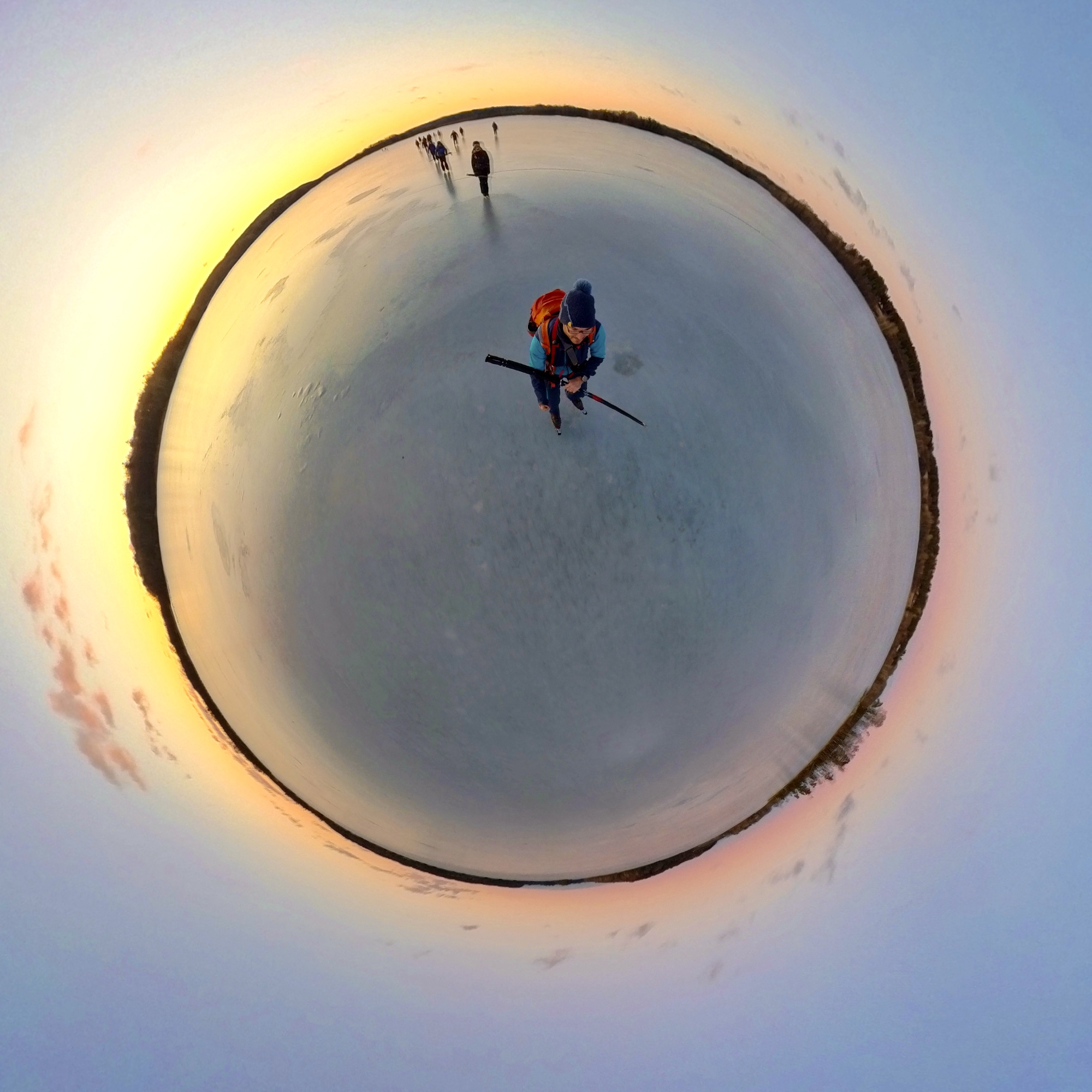 360 picture of a skater on endless lake during sunset