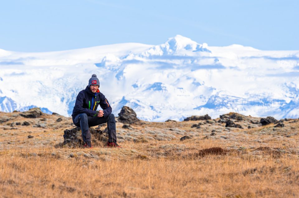 Climber in front of mountain Hvannadalshnúkur