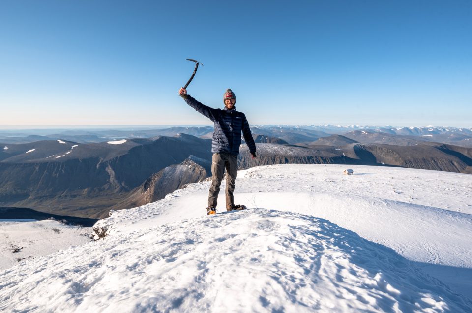 Man on top of Swedish highest mountain Kebnekaise