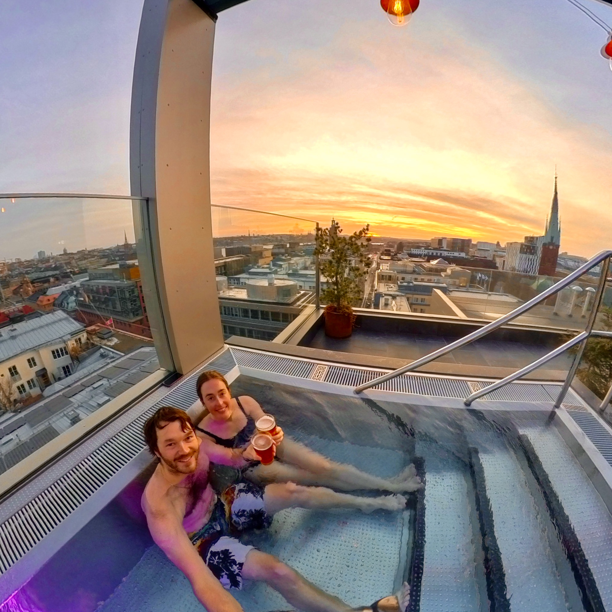 Drinking beer in an infinity pool at The Nest Wellness at Down Town Camper in Stockholm