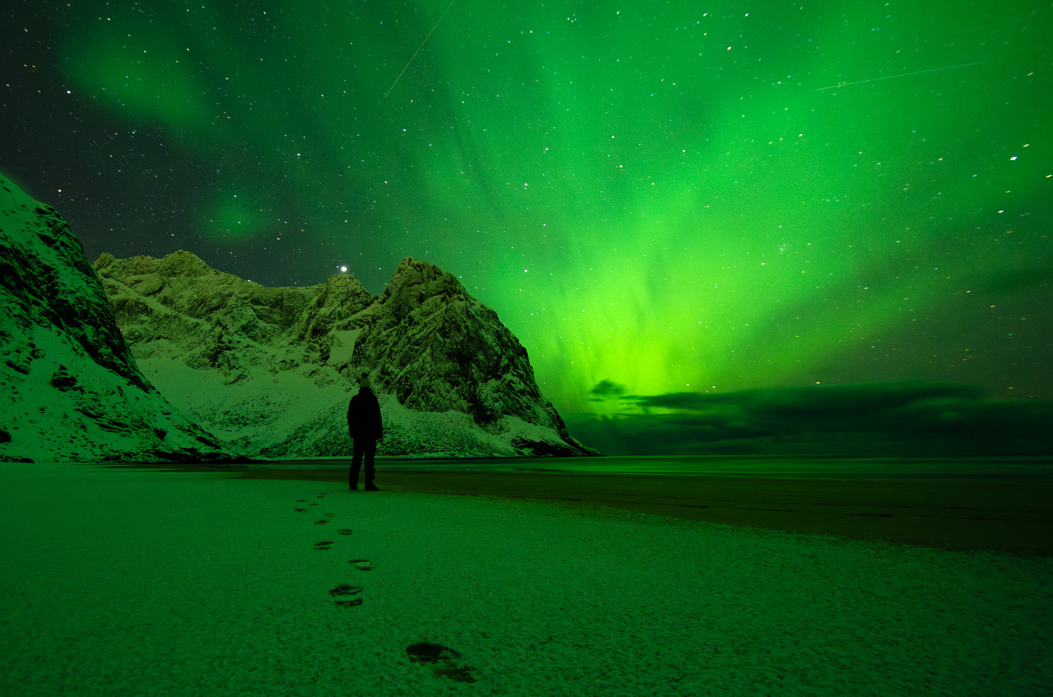 Admiring northern lights on Lofoten islands in Norway