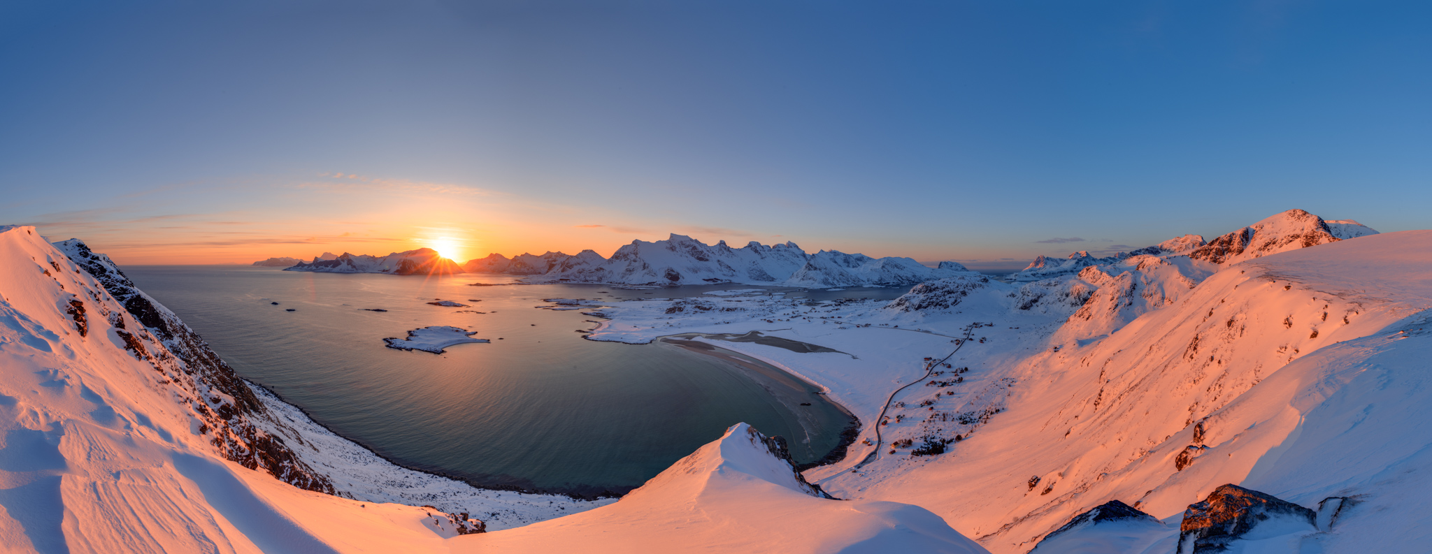 Winter view on snowy Lofoten islands from a mountain top